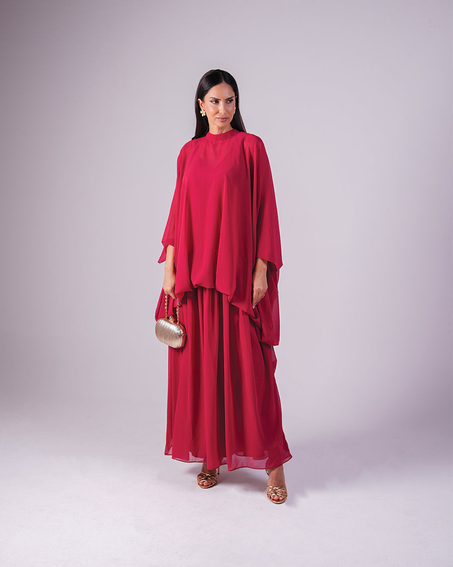 Full-length view of the Élan yellow chiffon dress styled with a blue fan.