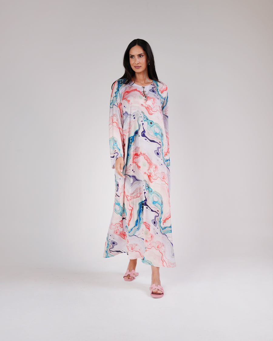 Model wearing the Lagoon Pearl & Coral silk dress in coral, aqua and lavender tones.