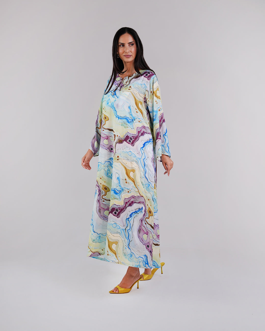 Full-length view of the Lagoon Azure silk dress and its relaxed modest silhouette.