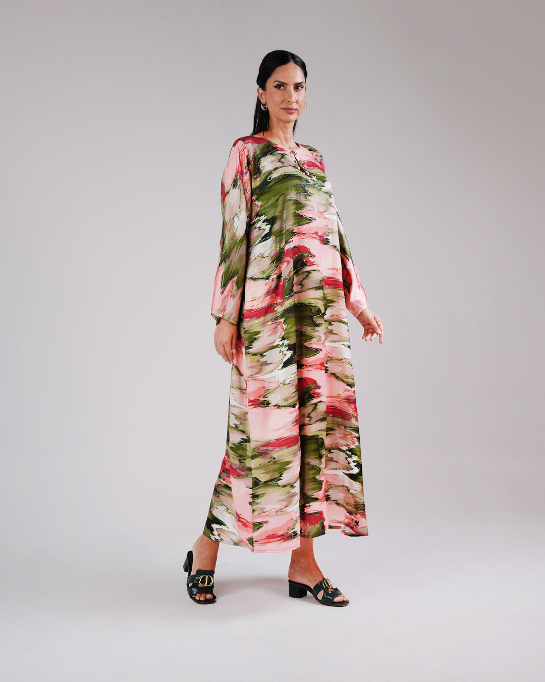 Full-length view of the Blossom Garden dress’s flowing botanical print.