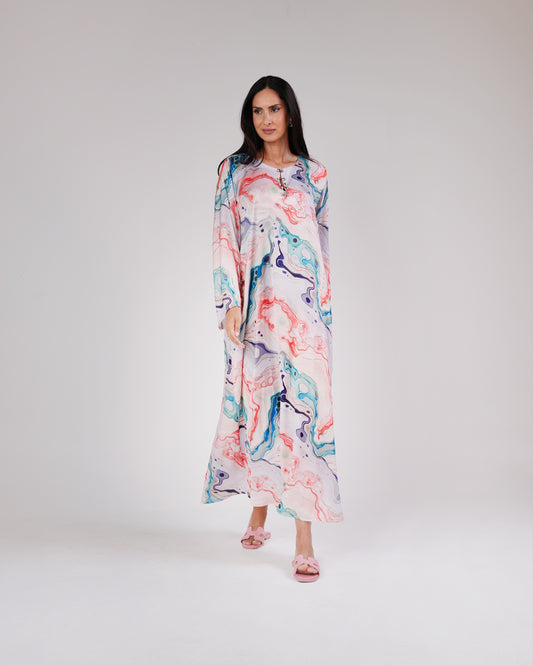 Model wearing the Lagoon Pearl & Coral silk dress in coral, aqua and lavender tones.