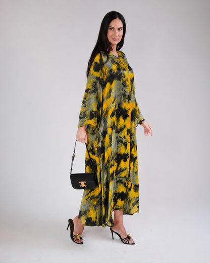 Full-length view of Mirelle yellow and black printed silk and chiffon dress