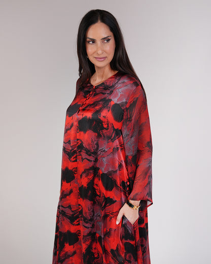 Front view of Mirelle Rouge dress showing its red and black artistic print