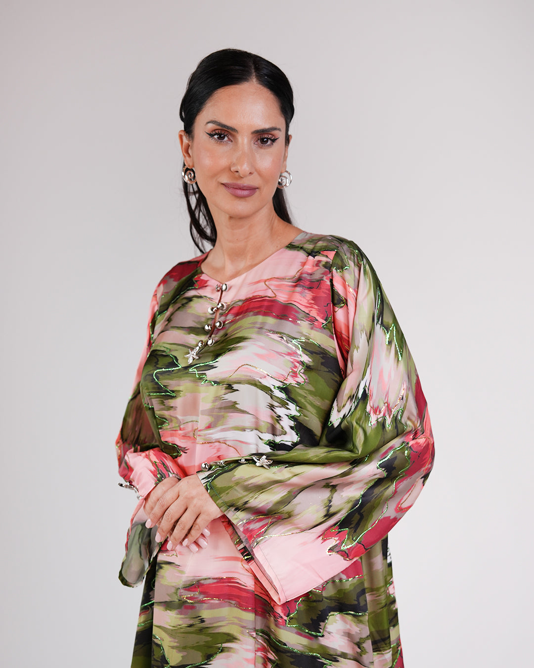 Upper-body view of the Blossom Garden silk dress and its relaxed sleeves.