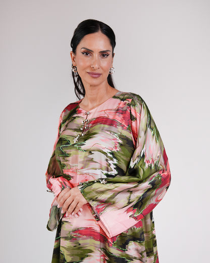 Upper-body view of the Blossom Garden silk dress and its relaxed sleeves.