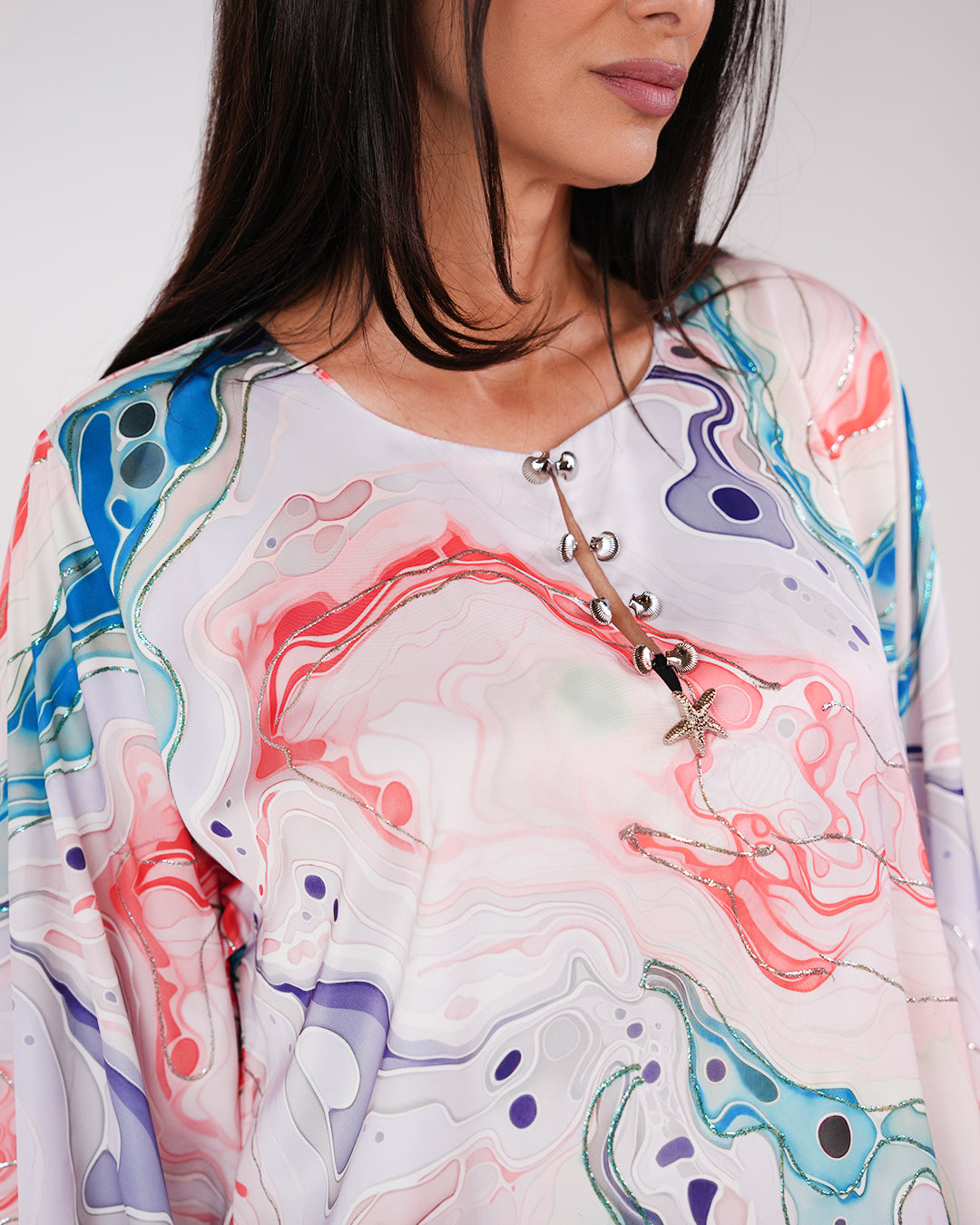 Full-length view of the Lagoon Pearl & Coral dress’s flowing modest silhouette.