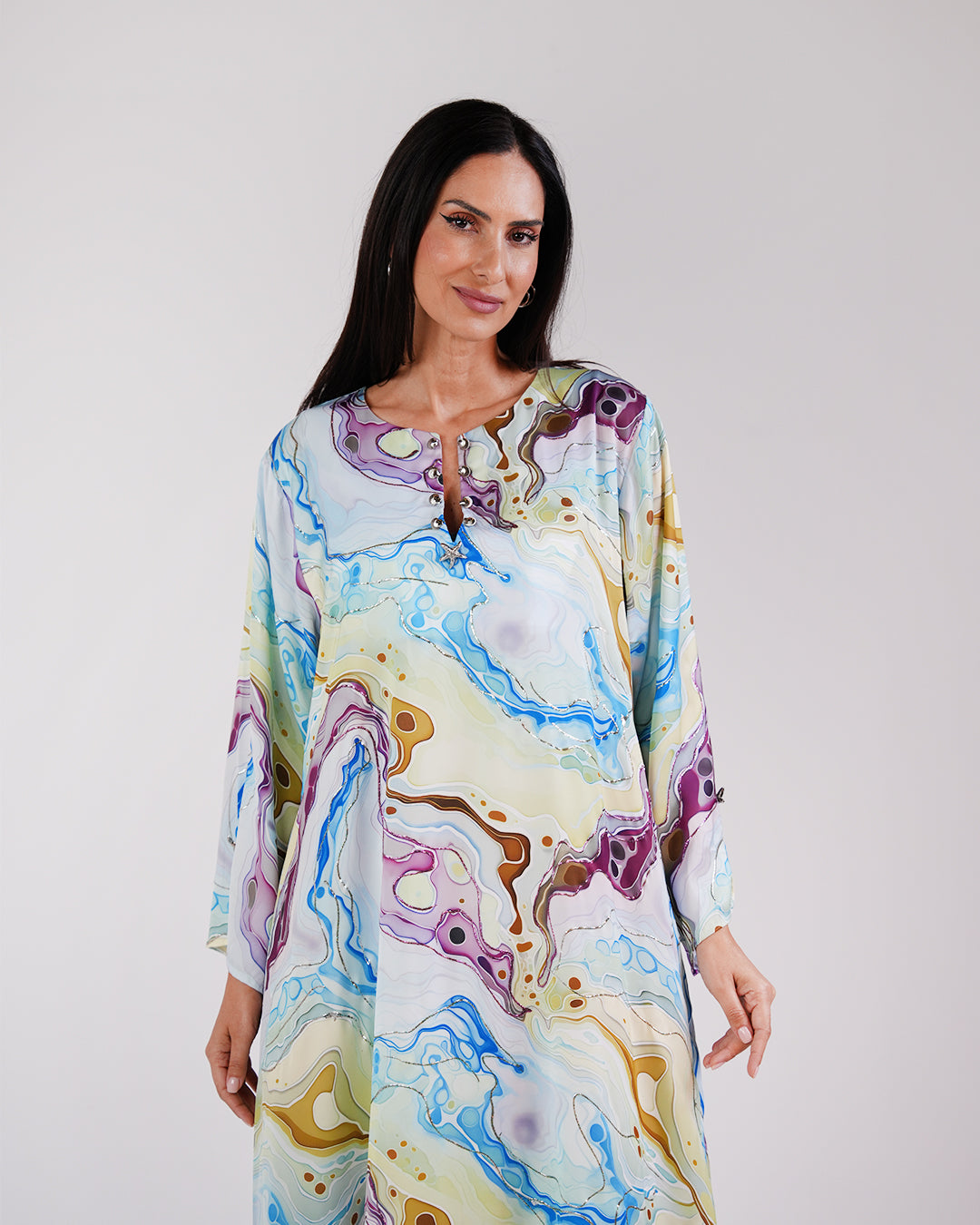 Upper-body view showing the Lagoon Azure dress’s neckline, sleeves and colourful print.