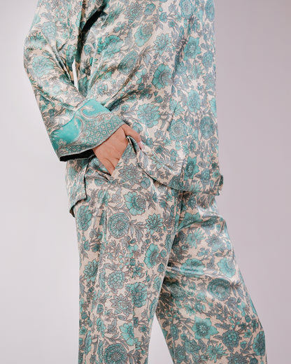 1. Detail of the Soleia Tiffany blue silk set showing the top, trousers and coordinated trim