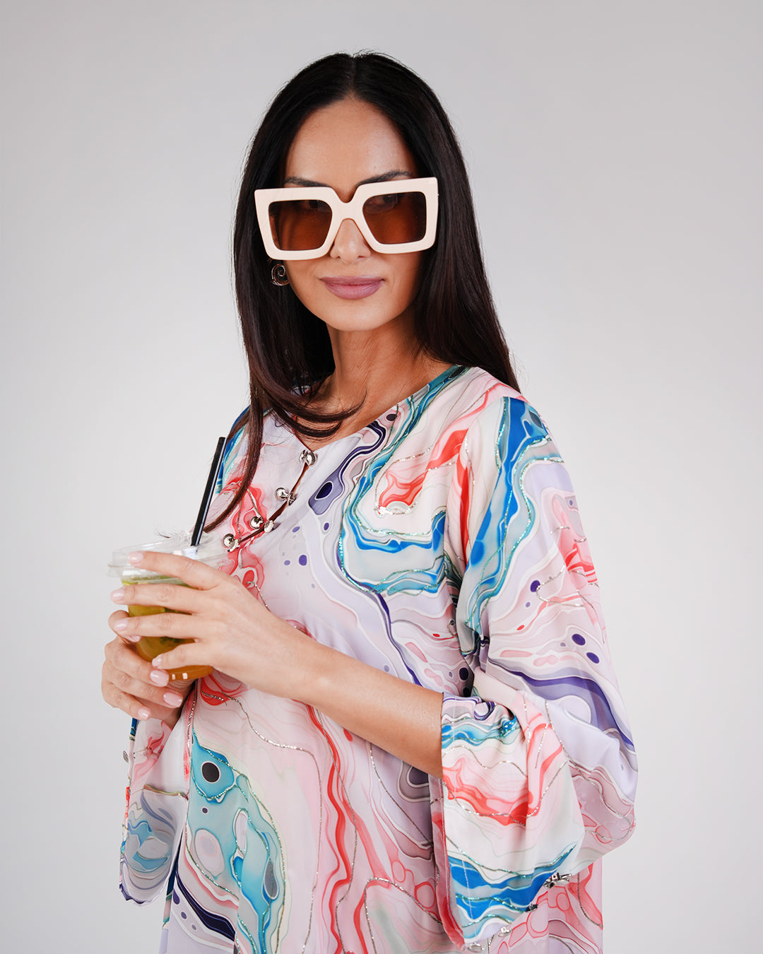 Close-up of the dress’s pearl-toned base and colourful ocean-inspired print.