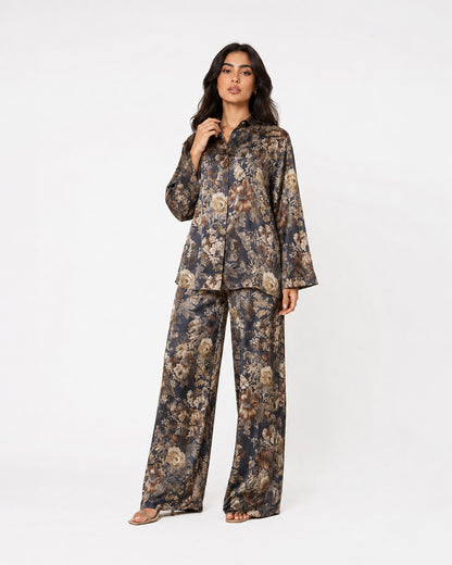 Front studio view of the Sahara Bloom navy floral silk shirt and matching wide-leg trousers.